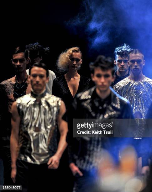 Models showcase designs on the runway during the Christian Dada show as part of Mercedes Benz Fashion Week Tokyo 2014 S/S at Hikarie Hall A of...