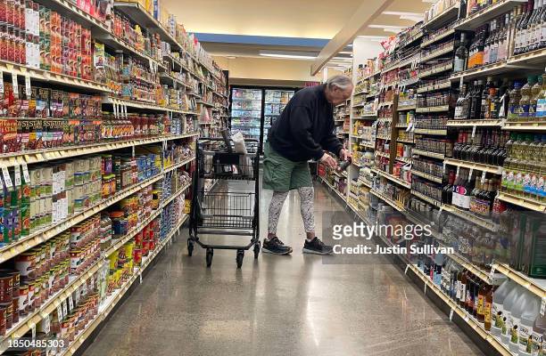 Customer shops at a grocery store on December 12, 2023 in San Anselmo, California. According to a report by the Bureau of Labor Statistics, inflation...