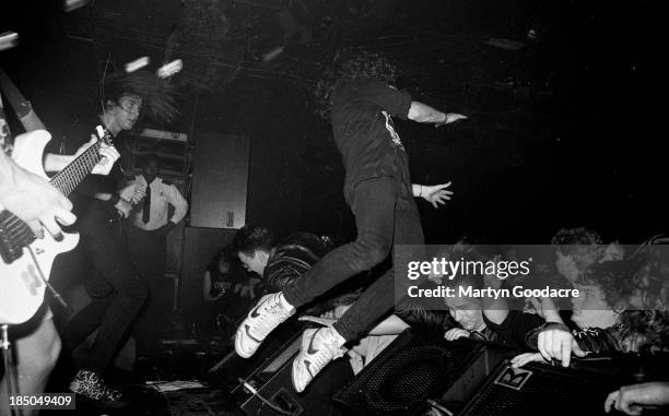 Crowd surfing as Napalm Death perform on stage at the ICA, London, United Kingdom, 1990.