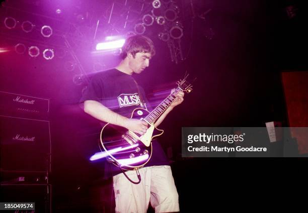 Noel Gallagher of Oasis performs on stage, United Kingdom, 1996.