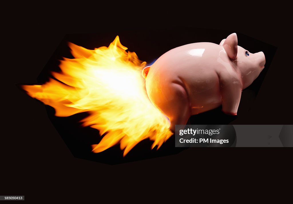 Flying piggy bank on fire
