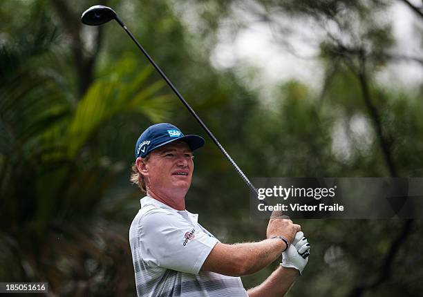 Ernie Els of South Africa tees off on the 2nd hole during day one of the Venetian Macau Open at Macau Golf and Country Club on October 17, 2013 in...