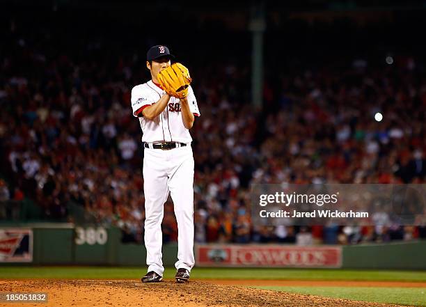 Koji Uehara of the Boston Red Sox pitches against the Tampa Bay Rays in the ninth inning of Game Two of the American League Division Series at Fenway...