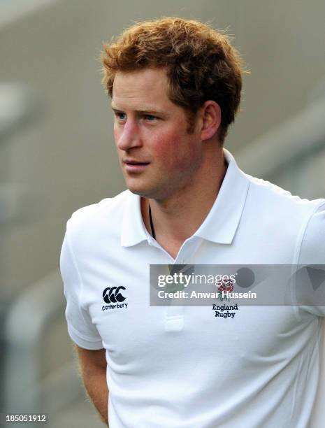 Prince Harry takes part in a rugby training game as he attends RFU All School Programme Coaching Event at Twickenham Stadium on October 17, 2013 in...