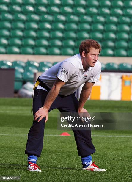 Prince Harry takes part in a rugby training game as he attends RFU All School Programme Coaching Event at Twickenham Stadium on October 17, 2013 in...