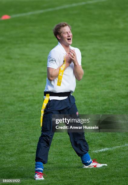 Prince Harry takes part in a rugby training game as he attends RFU All School Programme Coaching Event at Twickenham Stadium on October 17, 2013 in...