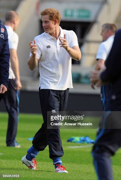 Prince Harry takes part in a rugby training game as he attends RFU All School Programme Coaching Event at Twickenham Stadium on October 17, 2013 in...