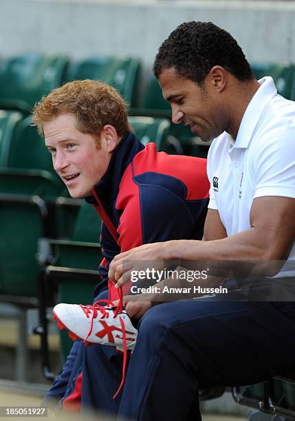 Prince Harry and former England International Jason Robinson prepare to take part in a rugby training game as they attend RFU All School Programme...