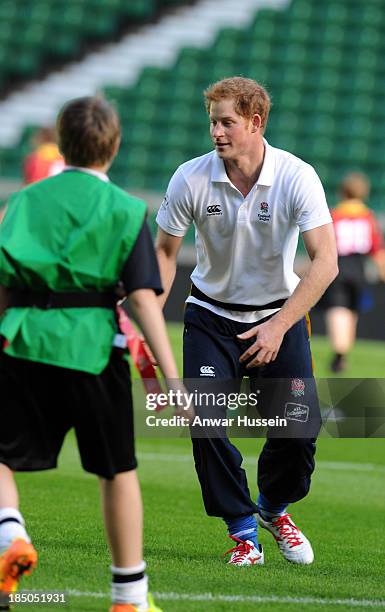 Prince Harry takes part in a rugby training game as he attends RFU All School Programme Coaching Event at Twickenham Stadium on October 17, 2013 in...