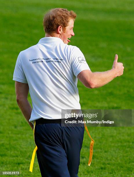 Prince Harry, in his role as Patron of the Rugby Football Union All Schools Programme, takes part in a rugby coaching session at Twickenham Stadium...