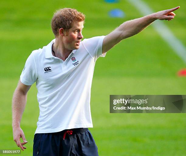 Prince Harry, in his role as Patron of the Rugby Football Union All Schools Programme, takes part in a rugby coaching session at Twickenham Stadium...