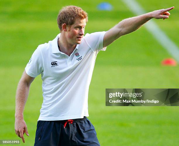 Prince Harry, in his role as Patron of the Rugby Football Union All Schools Programme, takes part in a rugby coaching session at Twickenham Stadium...