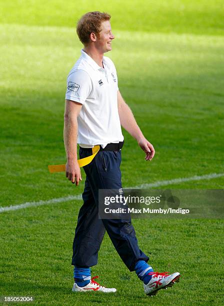 Prince Harry, in his role as Patron of the Rugby Football Union All Schools Programme, takes part in a rugby coaching session at Twickenham Stadium...