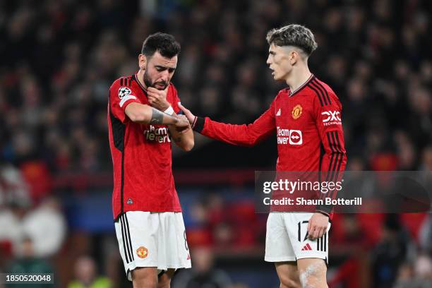 Bruno Fernandes of Manchester United reacts after a collision with Dayot Upamecano of Bayern Munich during the UEFA Champions League match between...