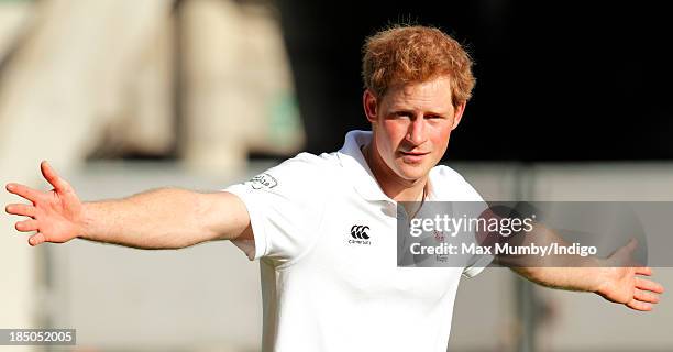 Prince Harry, in his role as Patron of the Rugby Football Union All Schools Programme, takes part in a rugby coaching session at Twickenham Stadium...