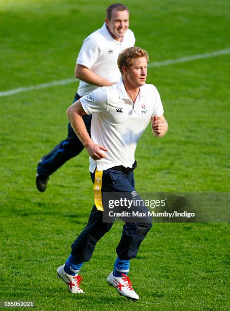 Prince Harry, in his role as Patron of the Rugby Football Union All Schools Programme, takes part in a rugby coaching session at Twickenham Stadium...