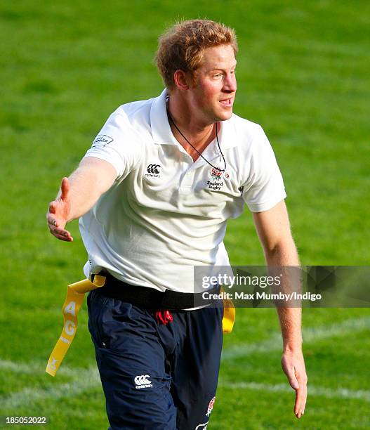 Prince Harry, in his role as Patron of the Rugby Football Union All Schools Programme, takes part in a rugby coaching session at Twickenham Stadium...