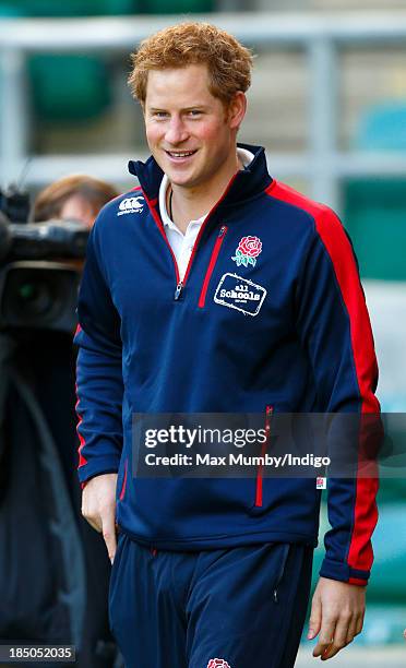 Prince Harry, in his role as Patron of the Rugby Football Union All Schools Programme, arrives to take part in a rugby coaching session at Twickenham...