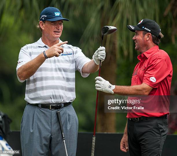 Ernie Els of South Africa and and Scott Hend of Australia talk on the 2nd tee during day one of the Venetian Macau Open at Macau Golf and Country...