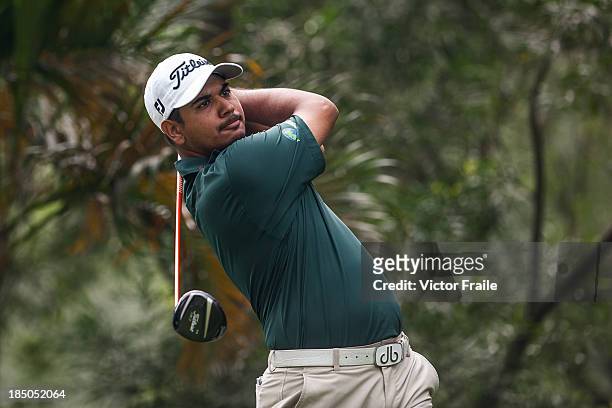 Gaganjeet Bhullar of India tees off on the 3rd hole during day one of the Venetian Macau Open at Macau Golf and Country Club on October 17, 2013 in...