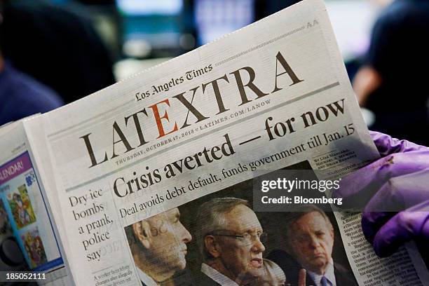 Press operators check the print quality of the Los Angeles Times LATEXTRA edition newspaper at the Olympic Press facility in Los Angeles, California,...