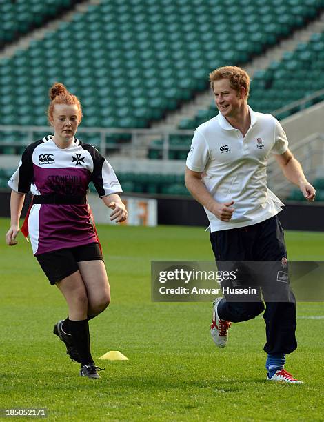 Prince Harry takes part in a rugby training game as he attends RFU All School Programme Coaching Event at Twickenham Stadium on October 17, 2013 in...