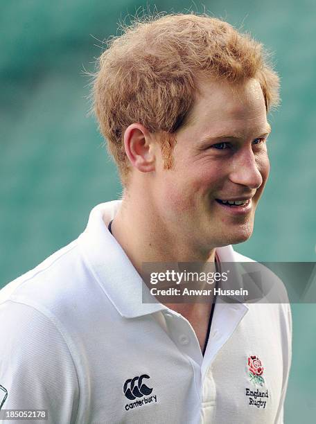 Prince Harry takes part in a rugby training game as he attends RFU All School Programme Coaching Event at Twickenham Stadium on October 17, 2013 in...