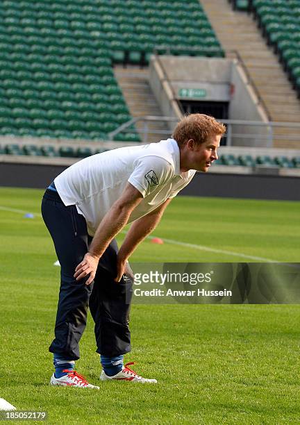 Prince Harry takes part in a rugby training game as he attends RFU All School Programme Coaching Event at Twickenham Stadium on October 17, 2013 in...