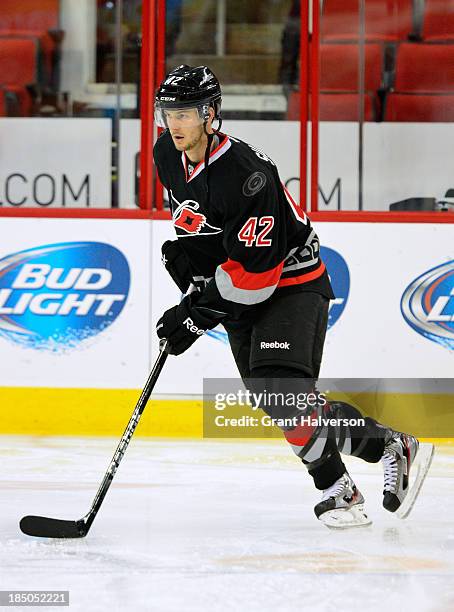 Brett Sutter of the Carolina Hurricanes against the Phoenix Coyotes during play at PNC Arena on October 13, 2013 in Raleigh, North Carolina. The...