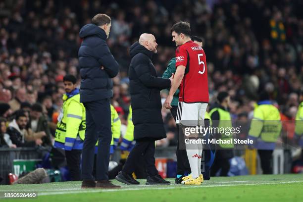 Harry Maguire of Manchester United shakes hands with Erik ten Hag, Manager of Manchester United, after being substituted due to injury during the...