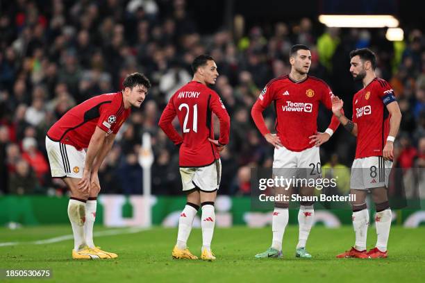 Harry Maguire of Manchester United reacts after suffering an injury during the UEFA Champions League match between Manchester United and FC Bayern...