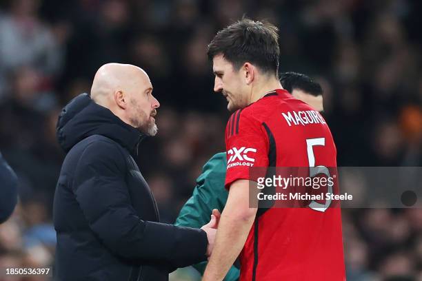 Harry Maguire of Manchester United shakes hands with Erik ten Hag, Manager of Manchester United, after being substituted due to injury during the...