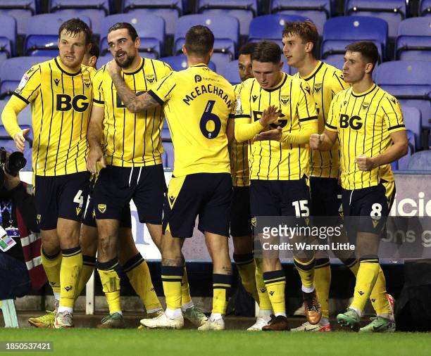 Ciaron Brown of Oxford UInited os congratulated after scoring the opening goal during the Sky Bet League One match between Reading and Oxford United...