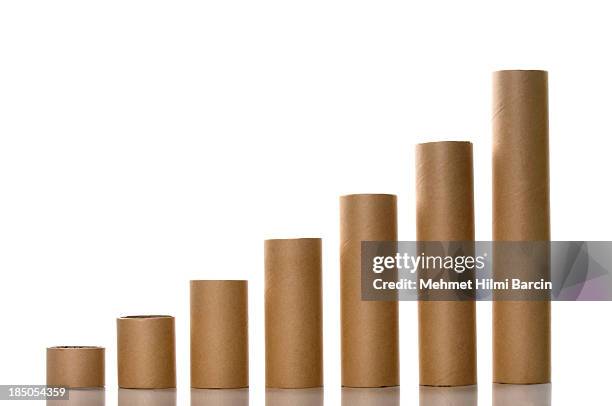 paper tubes like a graph - cylinder stock pictures, royalty-free photos & images