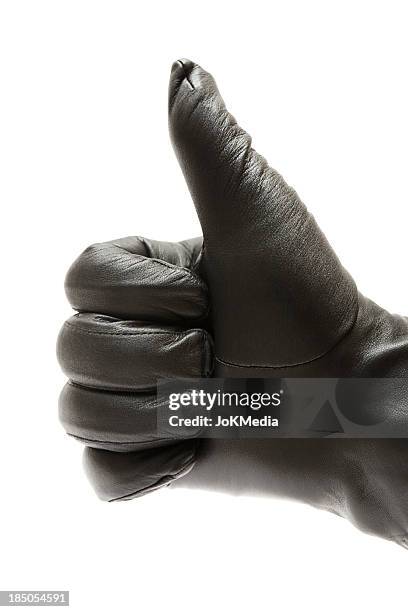 donnant thumbs up - paire de gants noirs photos et images de collection