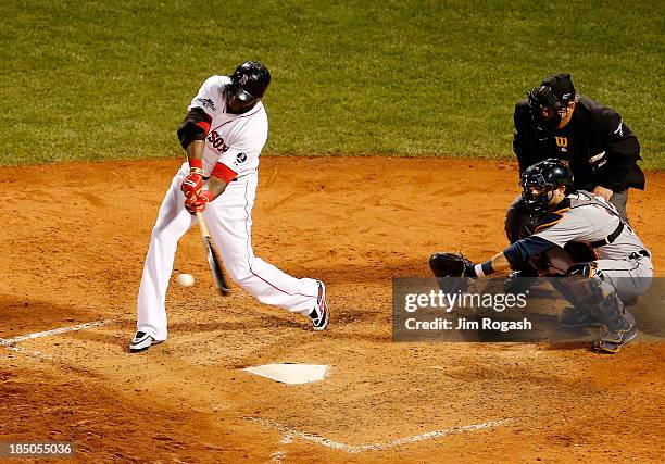 David Ortiz of the Boston Red Sox hits against the Detroit Tigers during Game One of the American League Championship Series at Fenway Park on...