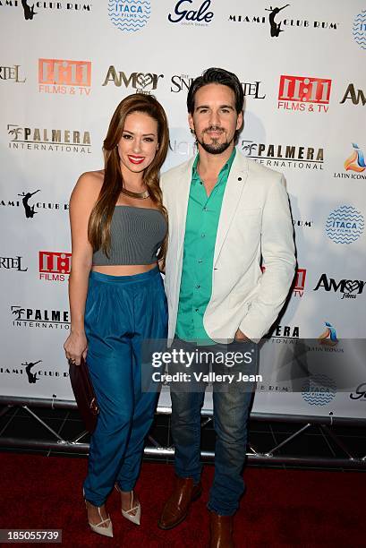 Sofia Lama and Leonardo Reyes arrive for the premiere of "The Snitch Cartel" at Regal South Beach on October 14, 2013 in Miami, Florida.