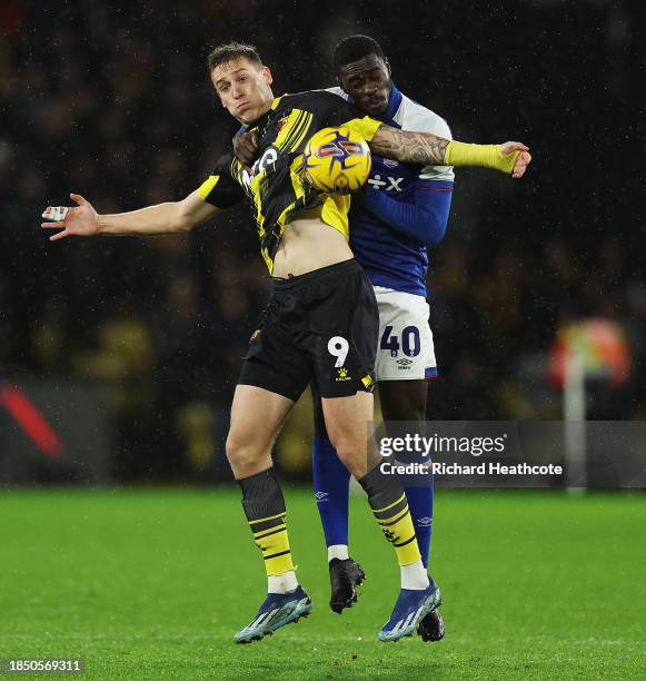 Mileta Rajovic of Watford jumps for the ball with Axel Tuanzebe of Ipswich Town during the Sky Bet Championship match between Watford and Ipswich...