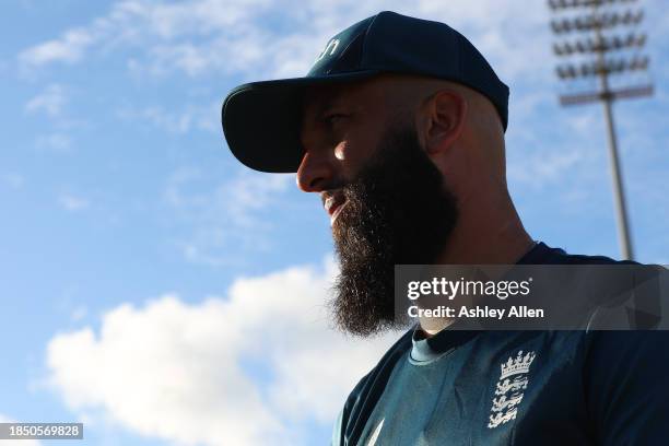 Moeen Ali of England warms up ahead of play during the 1st T20 International between West Indies and England at Kensington Oval on December 12, 2023...