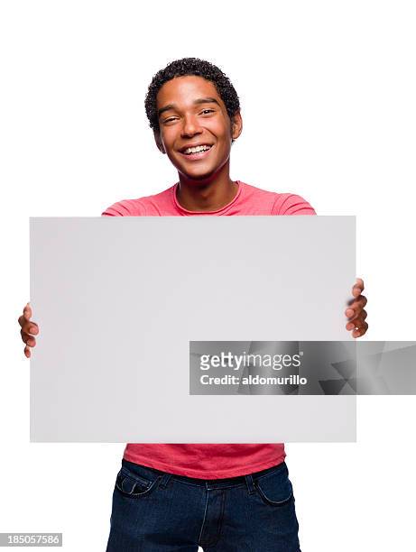 cheerful teenager holding a sign - placard stock pictures, royalty-free photos & images