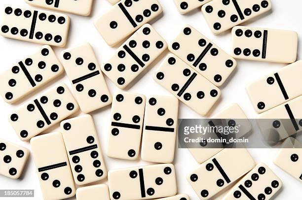 scattered ivory domino pieces isolated on white background - dominoes stock pictures, royalty-free photos & images
