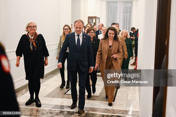 The leader of Civic Coalition and Prime Minister, Donald Tusk walks together with members of his cabinet after winning the vote of confidence at the...