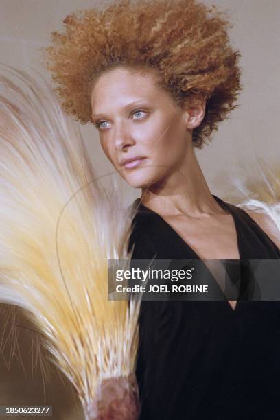 French model Christelle Saint-Louis Augustin presents a creation with feathers during the Jean-paul Gaultier 1998-99 Fall/winter high fashion...