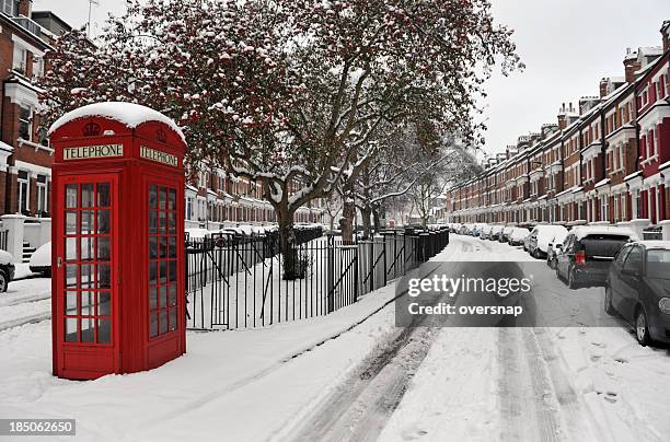 snow and phone box - winter wonderland london stock pictures, royalty-free photos & images