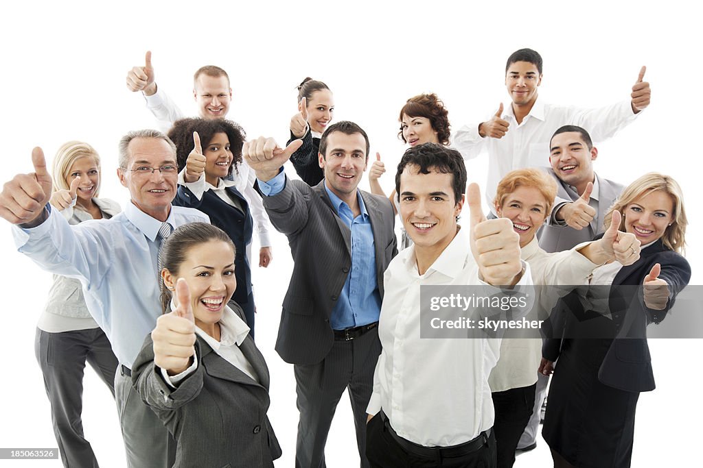 Group of business people holding up their thumbs