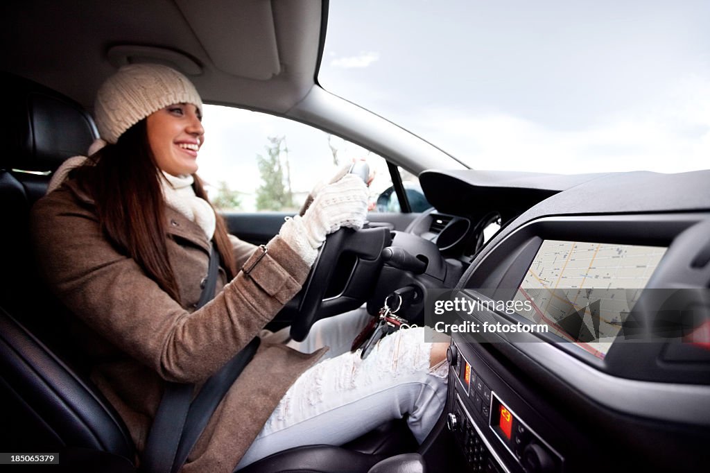 Women inside of the car, using navigational equipment