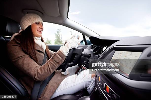 women inside of the car, using navigational equipment - winter car stock pictures, royalty-free photos & images