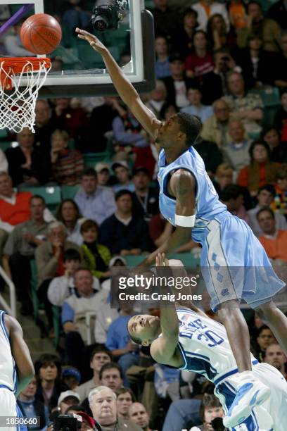 Jackie Manuel of the University of North Carolina Tar Heels is fouled by Dahntay Jones of the Duke Blue Devils during their semi-final game of the...