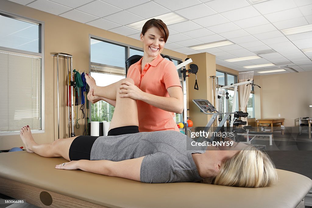 Physical therapist and patient in physical therapy clinic