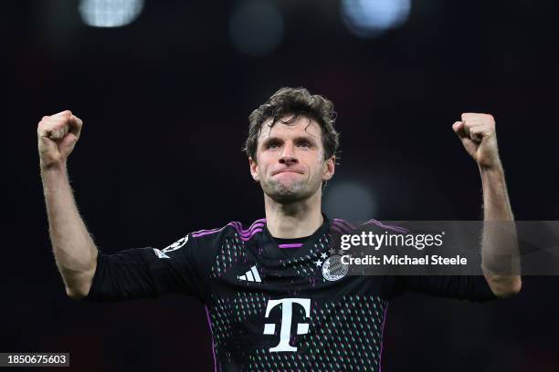 Thomas Mueller of Bayern Munich celebrates victory at full-time following the UEFA Champions League match between Manchester United and FC Bayern...